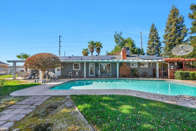 view of swimming pool with a patio area