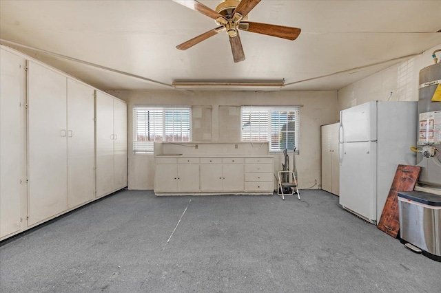 kitchen with ceiling fan, white cabinets, and white fridge