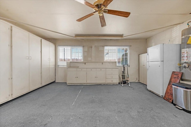 8302 S Leonard, Fowler, CA 93625 - interior space with freestanding refrigerator, ceiling fan, strapped water heater, and multiple windows