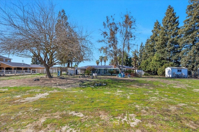 view of yard with a storage shed