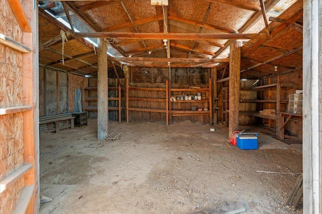 view of horse barn featuring vaulted ceiling