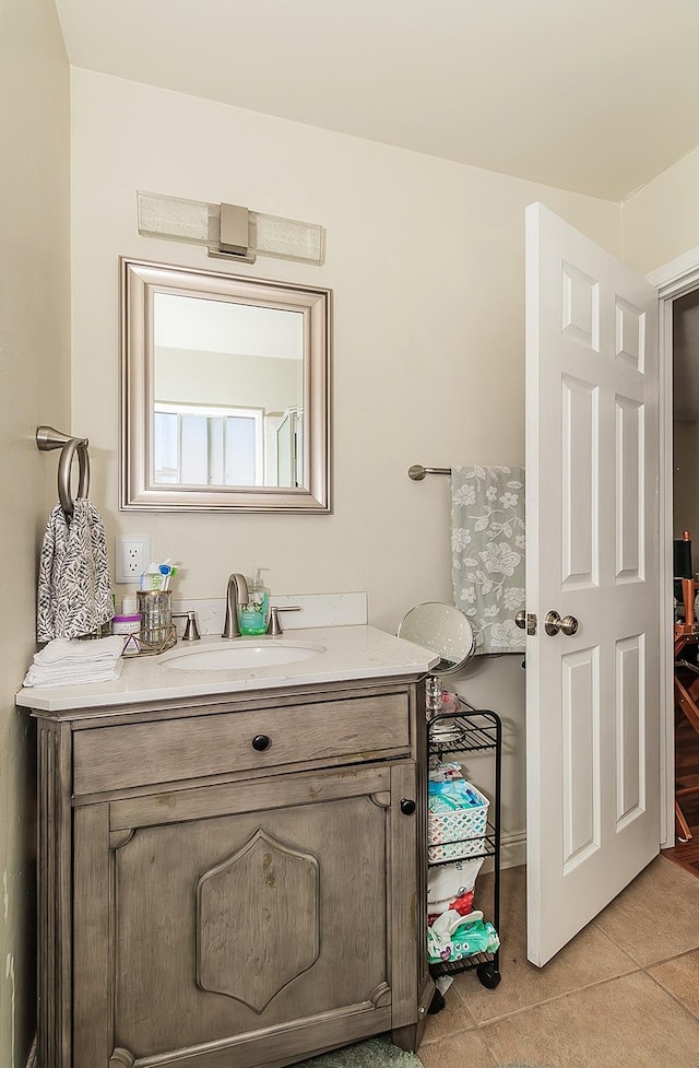 bathroom with vanity and tile patterned flooring