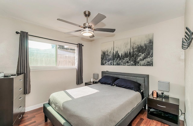 bedroom featuring ceiling fan and dark hardwood / wood-style flooring