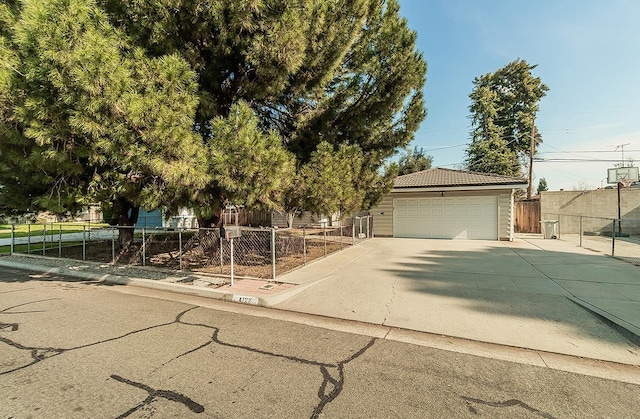 view of front of property with a garage and an outdoor structure