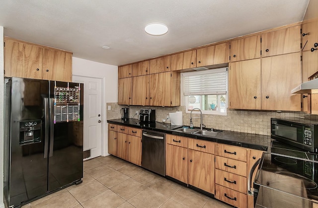 kitchen featuring light tile patterned flooring, sink, backsplash, and black appliances