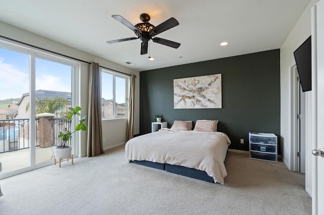 bedroom featuring light carpet, access to exterior, and ceiling fan