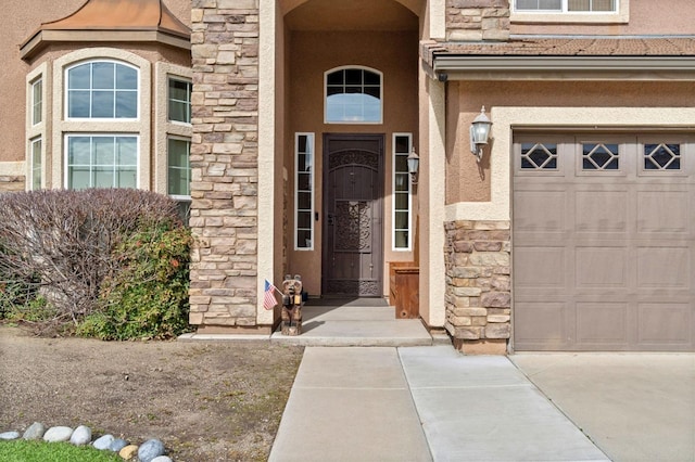 view of exterior entry featuring a garage