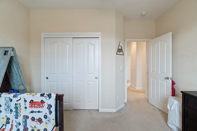 carpeted bedroom featuring a closet