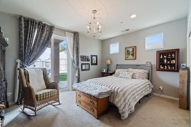 bedroom with light colored carpet, access to exterior, and a chandelier