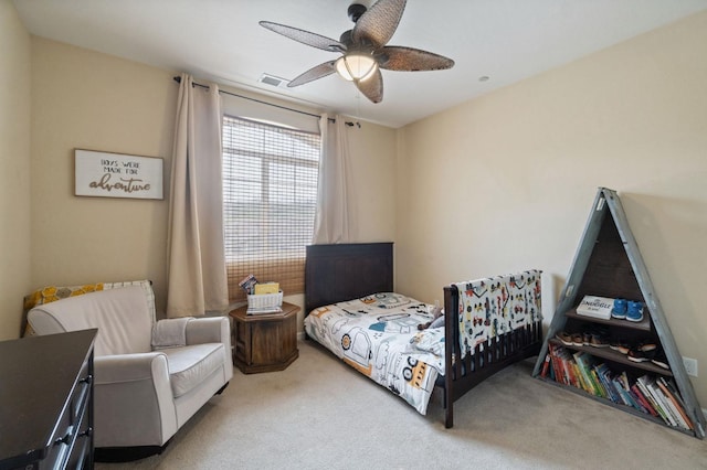 bedroom featuring light colored carpet and ceiling fan