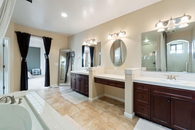 bathroom featuring vanity, tile patterned flooring, and shower with separate bathtub