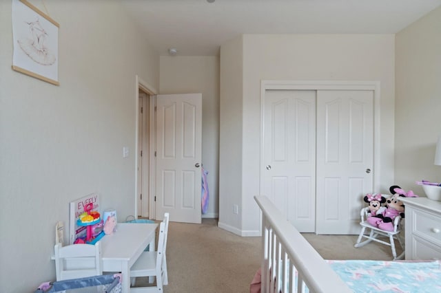 carpeted bedroom featuring a closet