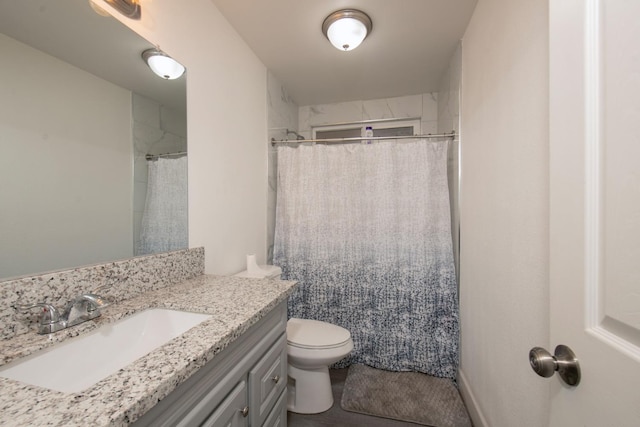 bathroom featuring vanity, toilet, and a shower with curtain