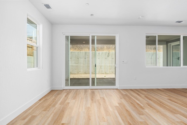 unfurnished room featuring light wood-type flooring