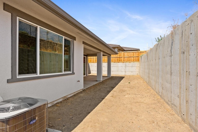 view of yard with central AC unit