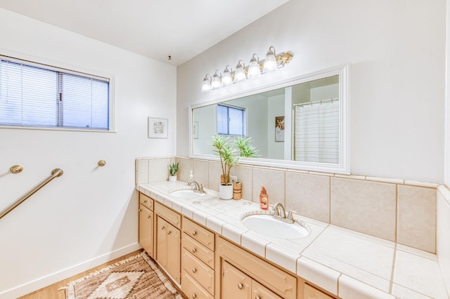 bathroom with vanity and decorative backsplash