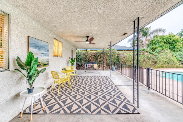 view of patio / terrace featuring ceiling fan