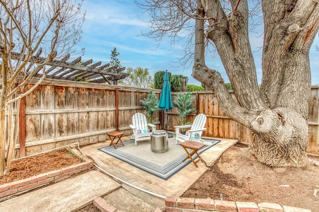 view of patio / terrace with a pergola and an outdoor fire pit