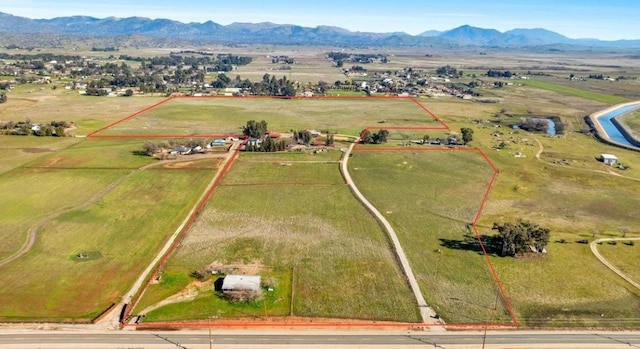 aerial view featuring a rural view and a mountain view