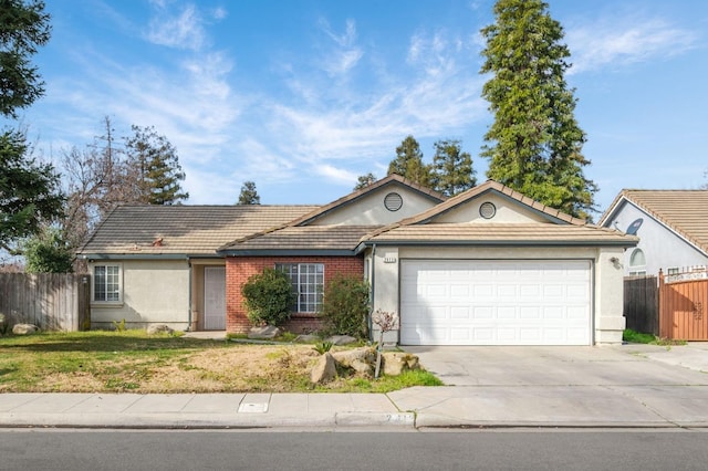 ranch-style home featuring a garage and a front yard