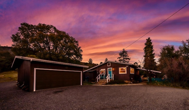 view of front of home featuring a garage and an outdoor structure