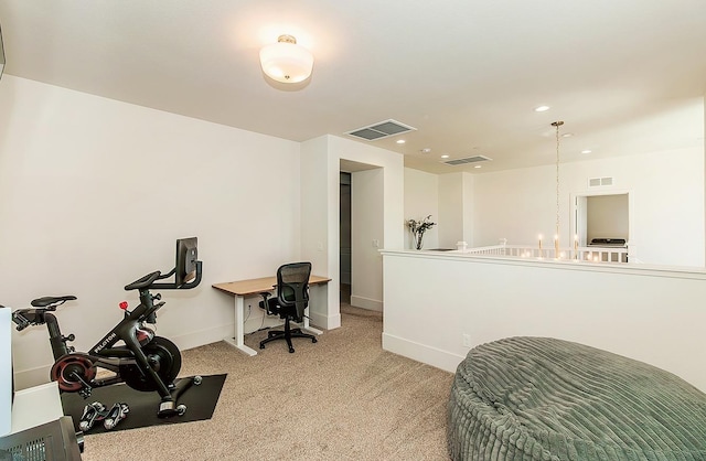 exercise room featuring visible vents, carpet floors, and baseboards