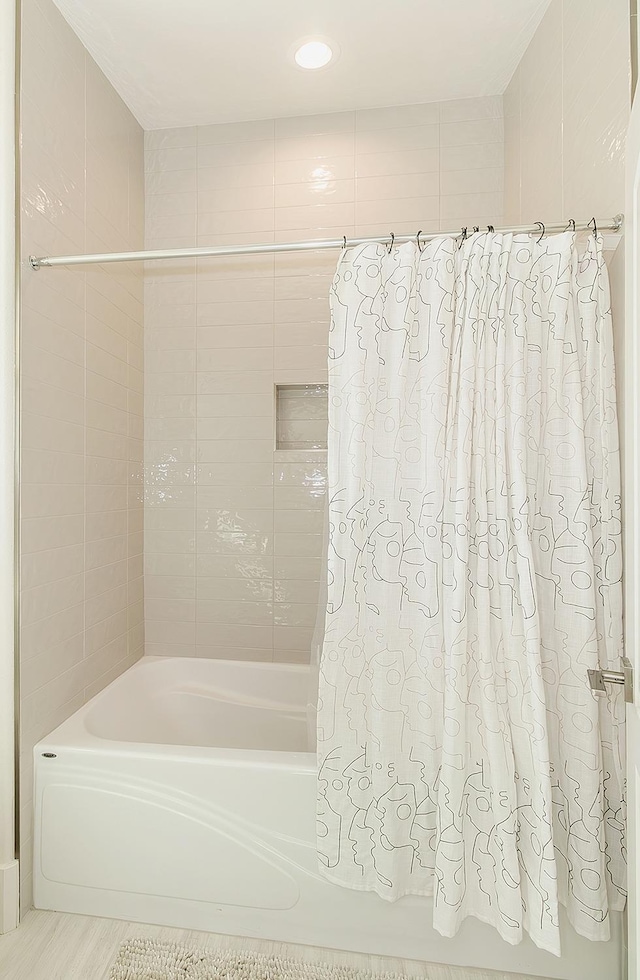 bathroom featuring shower / bath combo with shower curtain