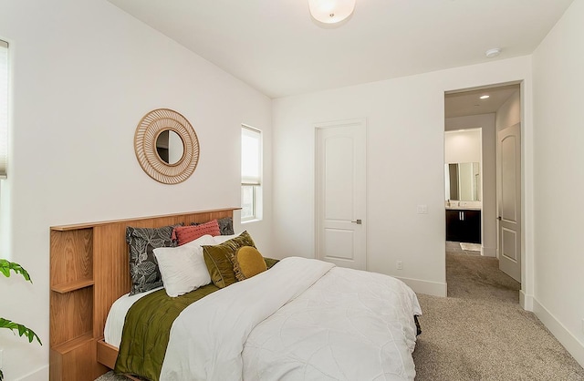 bedroom featuring carpet flooring and baseboards