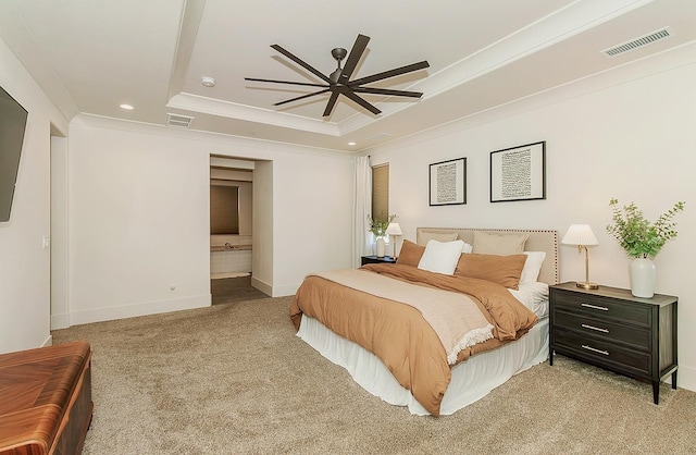 bedroom featuring a tray ceiling, visible vents, light colored carpet, and crown molding