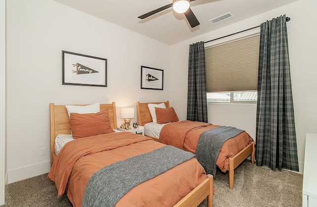 bedroom featuring carpet flooring, baseboards, visible vents, and ceiling fan