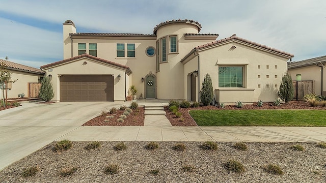 mediterranean / spanish home featuring a chimney, stucco siding, concrete driveway, a garage, and a tiled roof