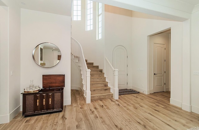 interior space featuring baseboards and wood finished floors
