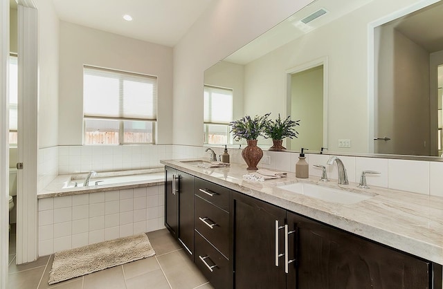 full bath featuring a sink, visible vents, toilet, and tile patterned floors