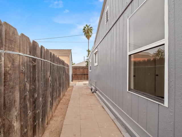 view of side of property featuring a patio