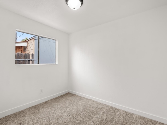 unfurnished room with carpet floors