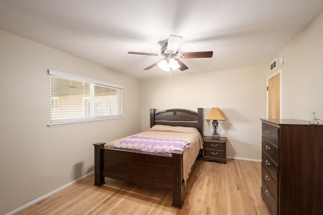 bedroom featuring light hardwood / wood-style floors and ceiling fan