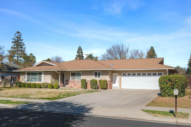 696 W Celeste Ave, Fresno, CA 93704 - ranch-style home with an attached garage, concrete driveway, a front yard, and stucco siding