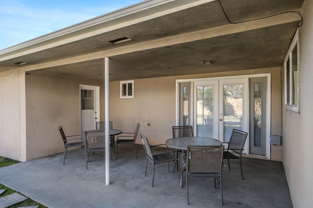 696 W Celeste Ave, Fresno, CA 93704 - view of patio / terrace with outdoor dining space and french doors