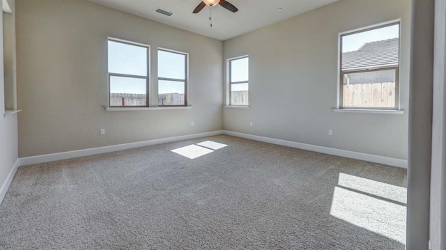 empty room featuring carpet and ceiling fan