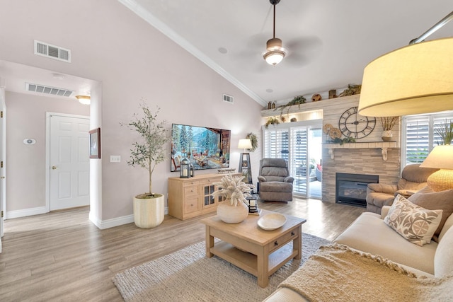 living room featuring visible vents and light wood-style flooring