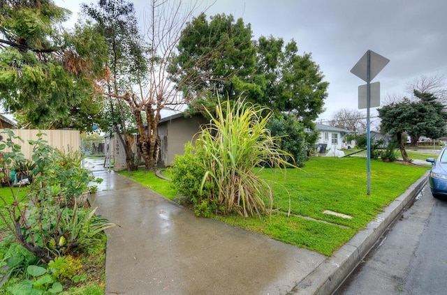 exterior space featuring fence and a yard