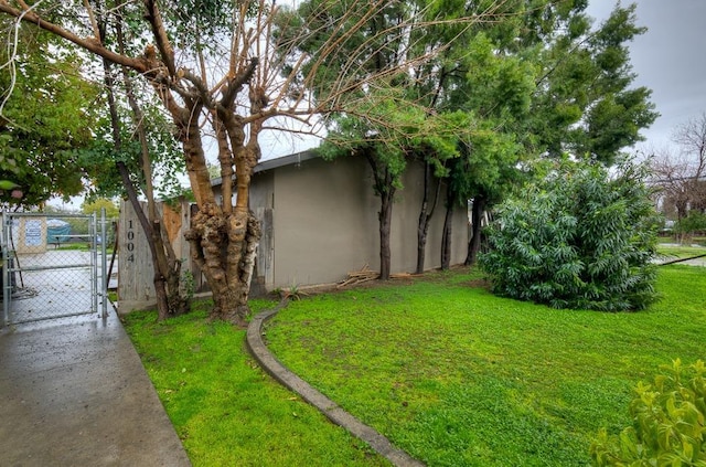 view of yard with fence and a gate