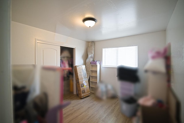 bedroom featuring a closet and wood finished floors