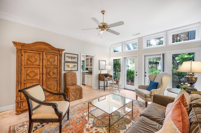 tiled living room featuring crown molding and ceiling fan