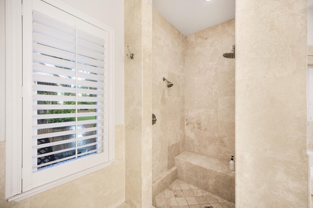 bathroom featuring a tile shower