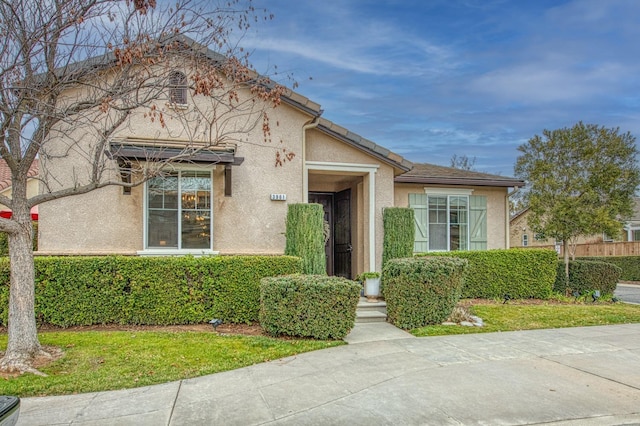 view of front of property featuring stucco siding