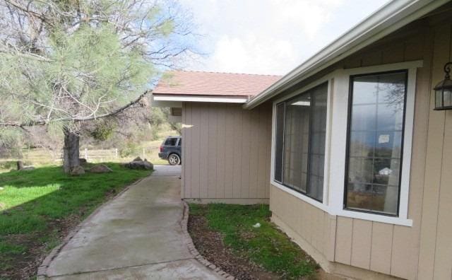 view of home's exterior featuring a yard