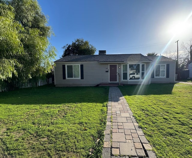 single story home featuring a front yard