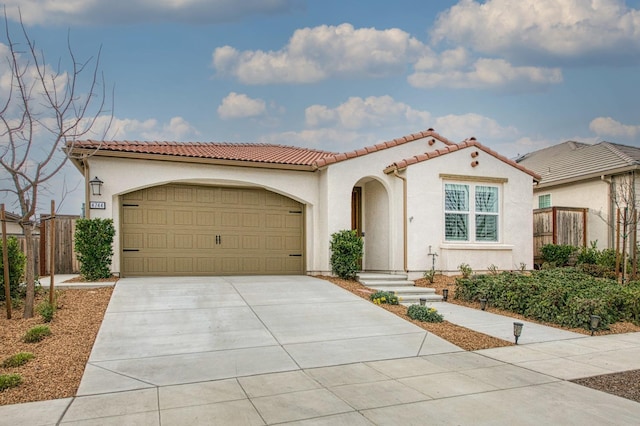 mediterranean / spanish-style home featuring a garage