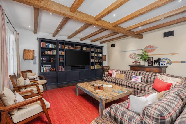 living room with beamed ceiling and wood-type flooring